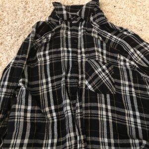 A black, grey, and white flannel